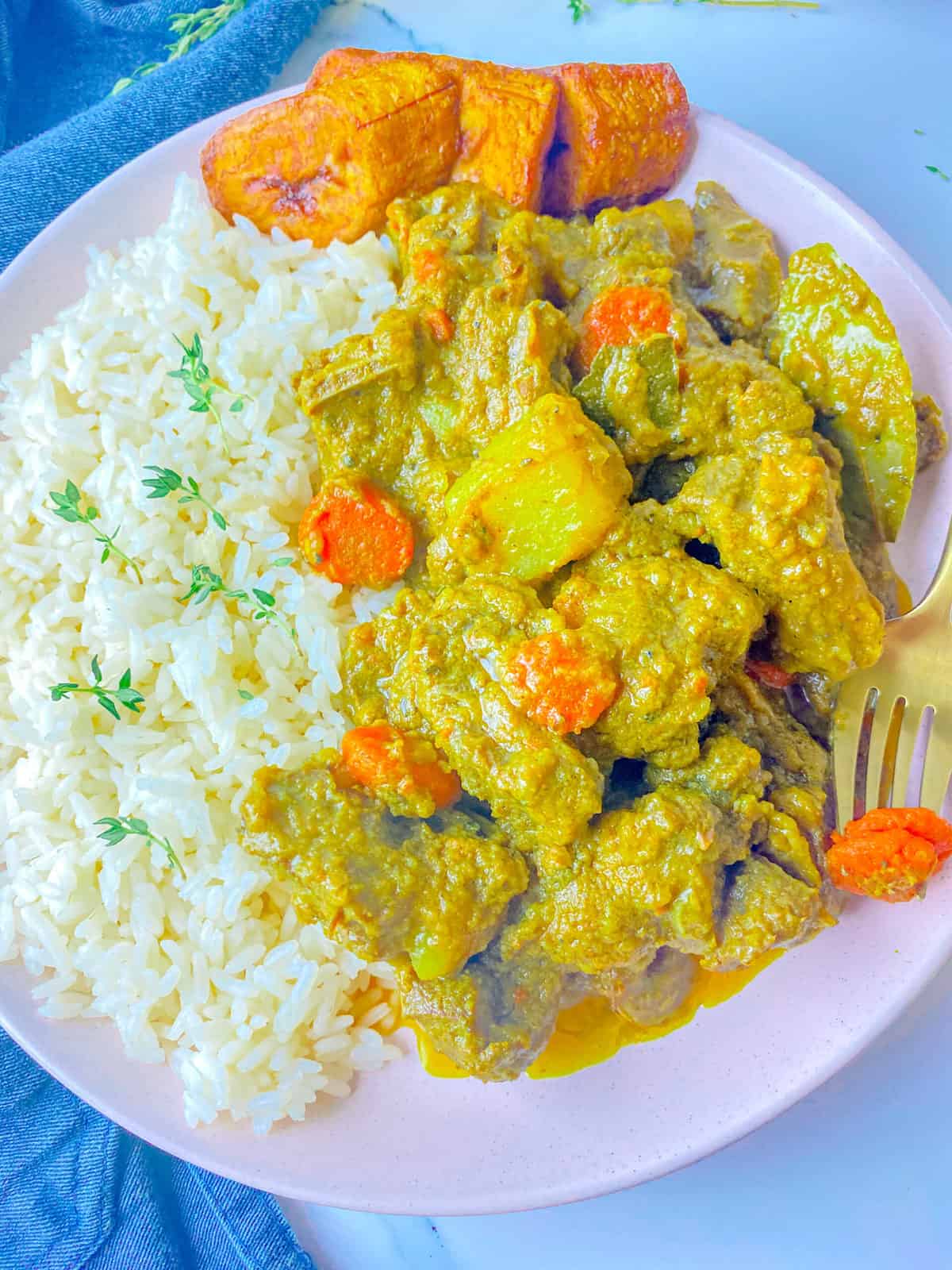 https://kerriannskravings.com/wp-content/uploads/2021/08/oven-cooked-curry-goat-_4340-scaled.jpg